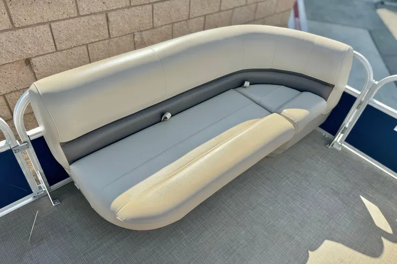 Slide: The Image of 2021 Sun Tracker Party Barge 18 DLX pontoon boat seating, beige upholstery, outdoor setting. - 9