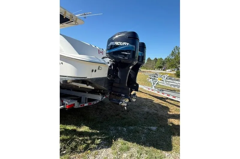Slide: The Image of 2004 Boston Whaler 320 Outrage with Mercury outboard engines on a trailer. - 3