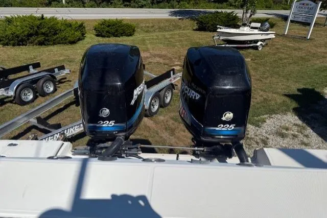 Slide: The Image of 2004 Boston Whaler 320 Outrage with twin Mercury 225 engines on a trailer. - 4