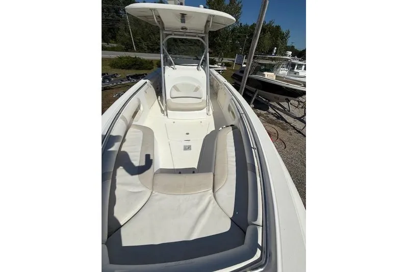 Slide: The Image of 2004 Boston Whaler 320 Outrage boat with spacious seating and center console. - 5
