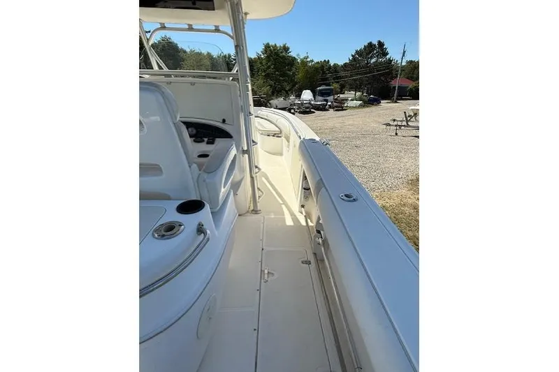 Slide: The Image of 2004 Boston Whaler 320 Outrage boat interior with seating and control panel. - 7