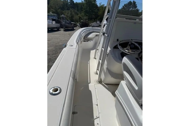 Slide: The Image of 2004 Boston Whaler 320 Outrage boat interior with steering console and seating. - 8