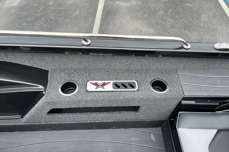 Slide: The Image of 2025 Vexus ADX190 boat interior with cup holders and sleek design. - 12