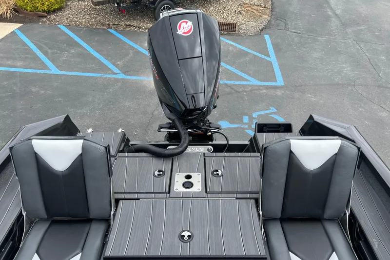 Slide: The Image of 2025 Vexus ADX190 boat interior with dual seats and outboard motor. - 14