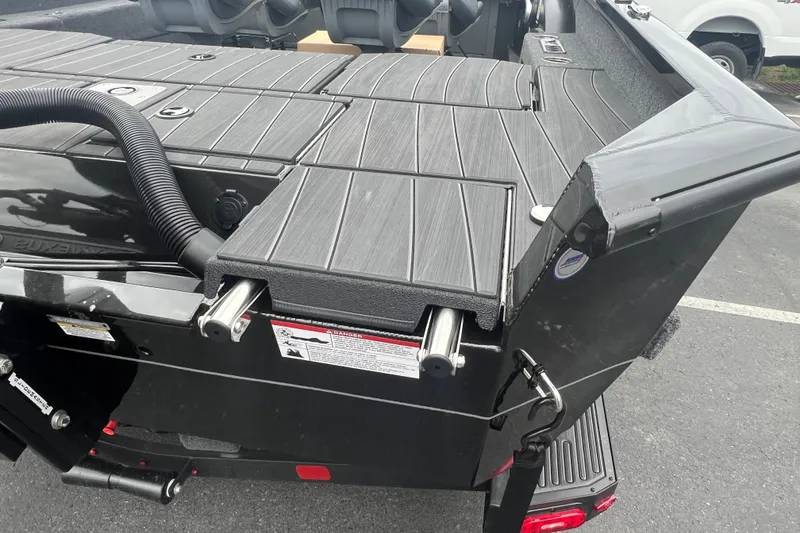 Slide: The Image of 2025 Vexus ADX190 boat deck with sleek black finish and modern design. - 16