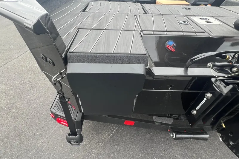 Slide: The Image of 2025 Vexus ADX190 boat deck with sleek black finish and modern design elements. - 17