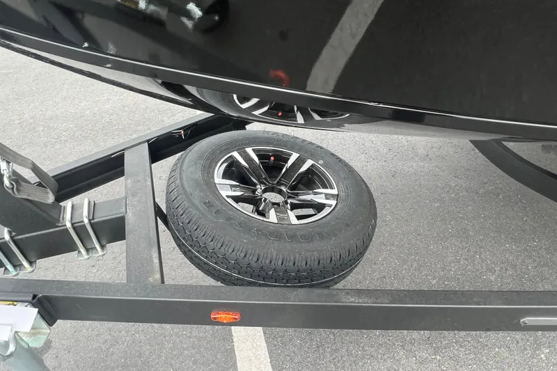 Slide: The Image of 2025 Vexus ADX190 trailer with spare tire on asphalt. - 3