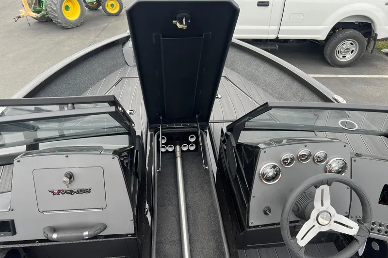 Slide: The Image of 2025 Vexus ADX190 boat interior with steering wheel and dashboard controls. - 5