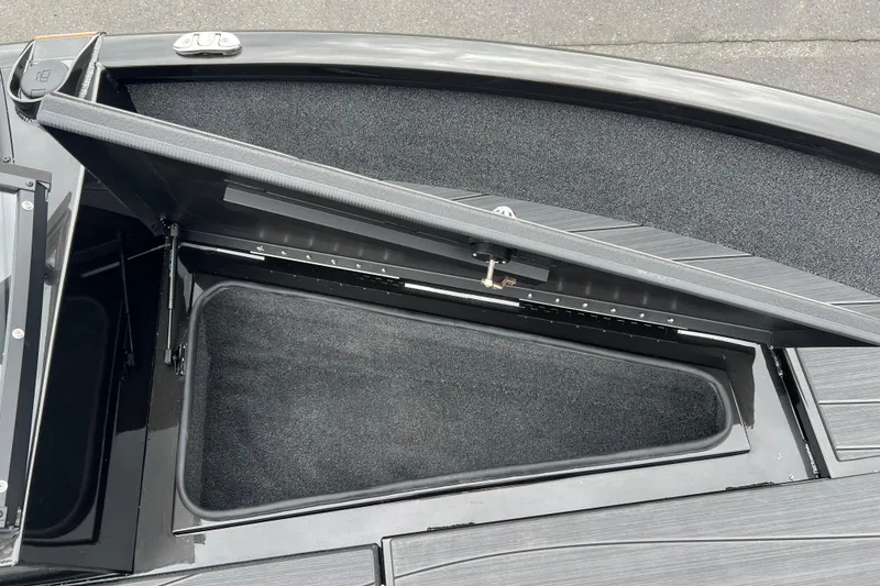 Slide: The Image of Open storage compartment on 2025 Vexus ADX190 boat, showcasing interior space and design. - 7