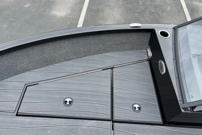 Slide: The Image of 2025 Vexus ADX190 boat deck with sleek design and storage compartments. - 8