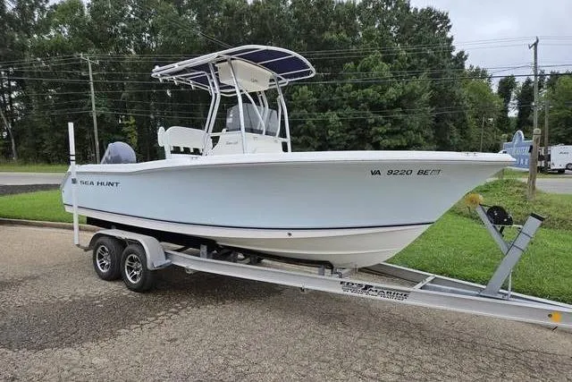 Slide: The Image of 2007 Sea Hunt Triton 220 boat on trailer, parked outdoors. - 5