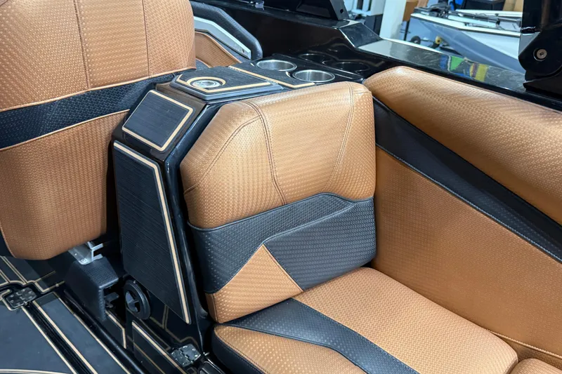 Slide: The Image of Luxurious interior of 2021 Centurion Ri265 boat with tan and black seating. - 17