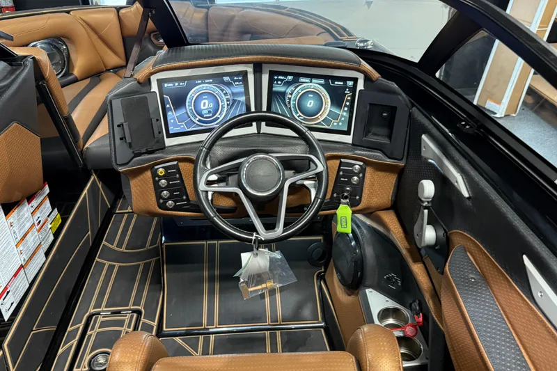 Slide: The Image of 2021 Centurion Ri265 boat interior with modern dashboard and dual digital displays. - 22