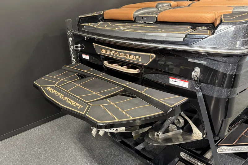 Slide: The Image of 2021 Centurion Ri265 boat rear view with swim platform and sleek design. - 4