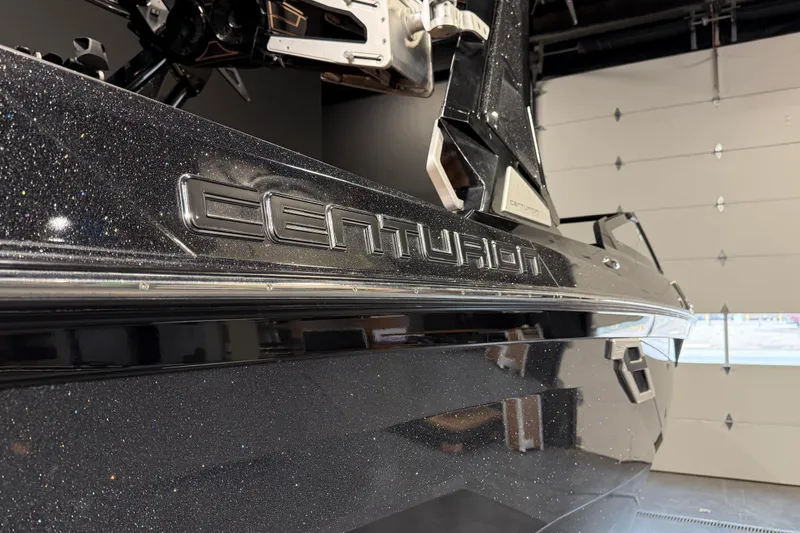 Slide: The Image of 2021 Centurion Ri265 boat with metallic finish in a showroom. - 7