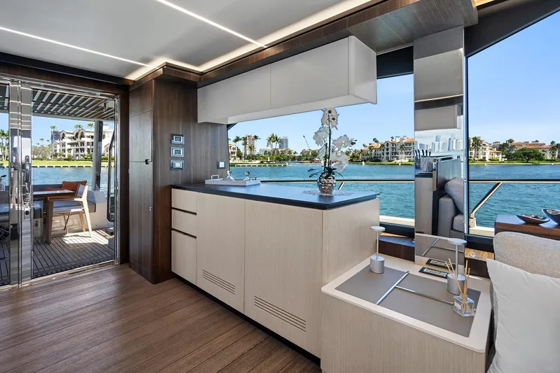 Slide: The Image of Luxurious interior of 2023 Astondoa 66 Flybridge yacht with modern kitchen and scenic water view. - 16