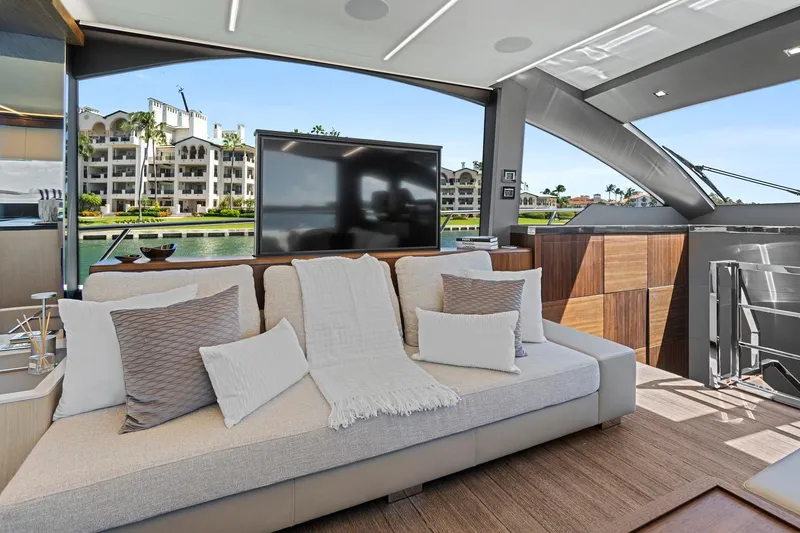 Slide: The Image of Luxurious interior of 2023 Astondoa 66 Flybridge yacht with elegant seating and waterfront view. - 18