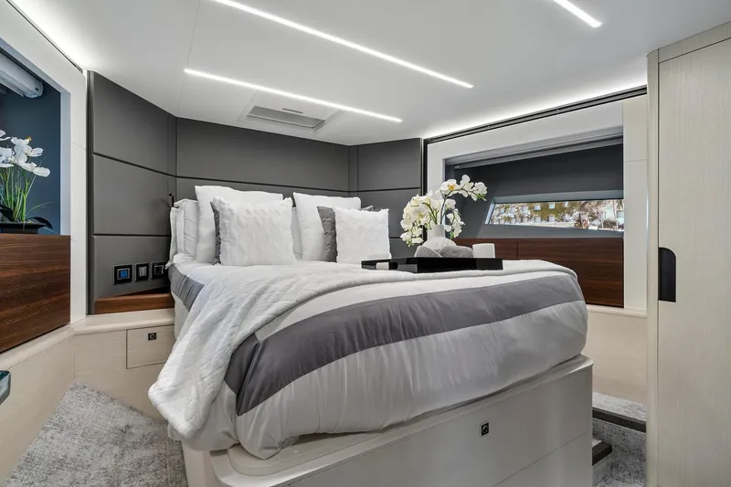 Slide: The Image of Luxurious bedroom interior of 2023 Astondoa 66 Flybridge yacht with modern design and elegant decor. - 25