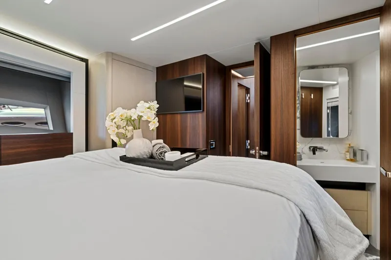 Slide: The Image of Luxurious bedroom in 2023 Astondoa 66 Flybridge yacht with elegant decor and modern amenities. - 32