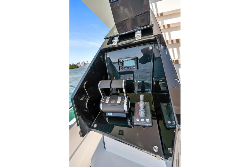 Slide: The Image of Control panel of 2023 Astondoa 66 Flybridge yacht with throttle and joystick controls. - 5