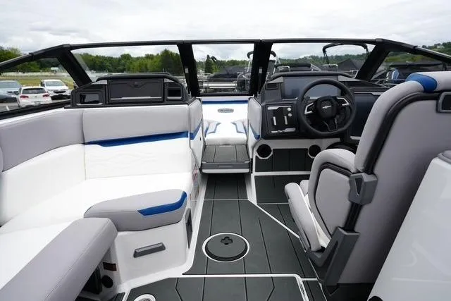 Slide: The Image of 2026 Supra SA boat interior with modern seating and sleek dashboard design. - 11