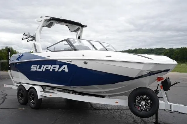 Slide: The Image of 2026 Supra SA boat on trailer, featuring sleek design and modern features. - 3