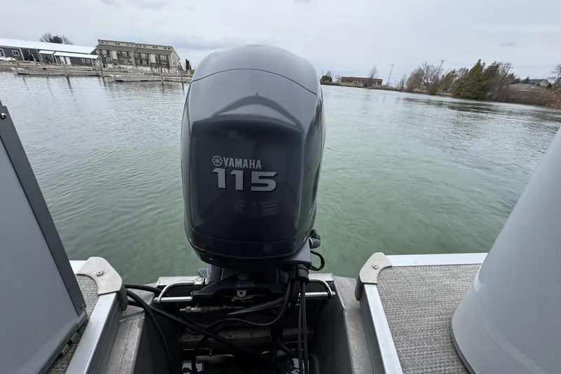 Slide: The Image of 2007 Manitou Aurora boat interior with plush, curved seating in neutral tones. - 13