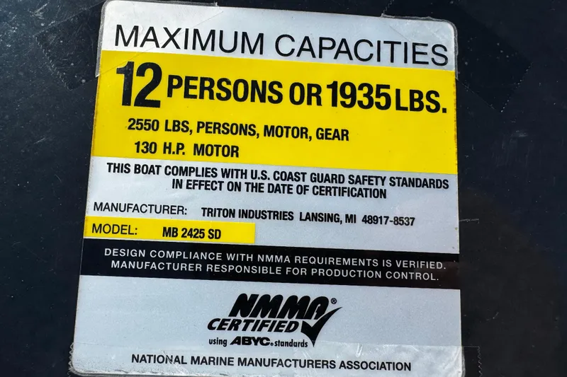 Slide: The Image of Maximum capacity label for 2007 Manitou Aurora boat, 12 persons or 1935 lbs, 130 HP motor. - 17