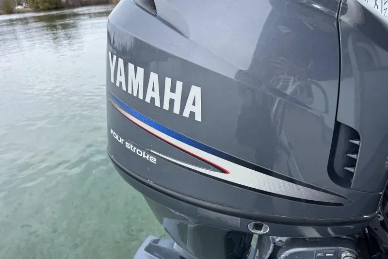 Slide: The Image of 2007 Manitou Aurora pontoon boat at Elk Rapids Marina, available for rent. - 3