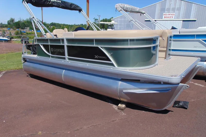 The Image of 2026 Godfrey EX 1880CX pontoon boat displayed outdoors. - 1