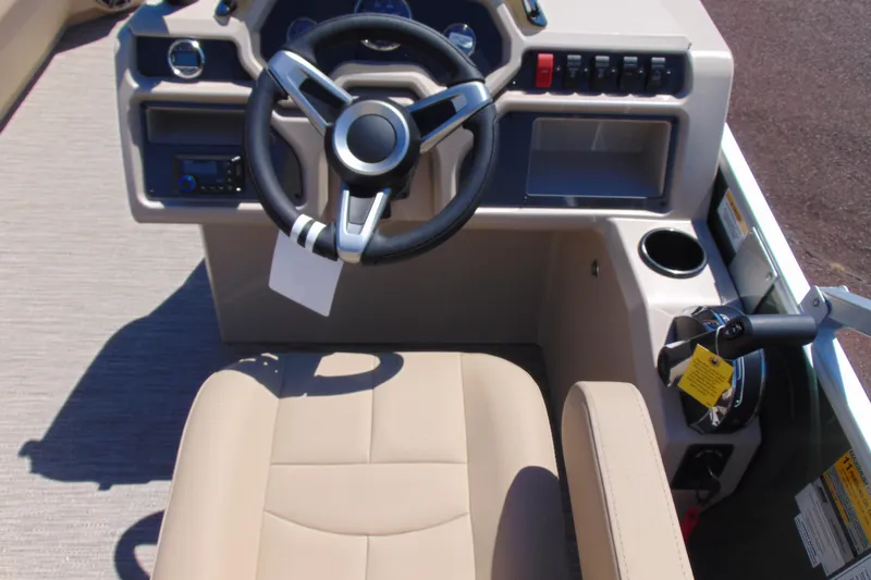 Slide: The Image of 2026 Godfrey EX 1880CX boat cockpit with steering wheel and control panel. - 11