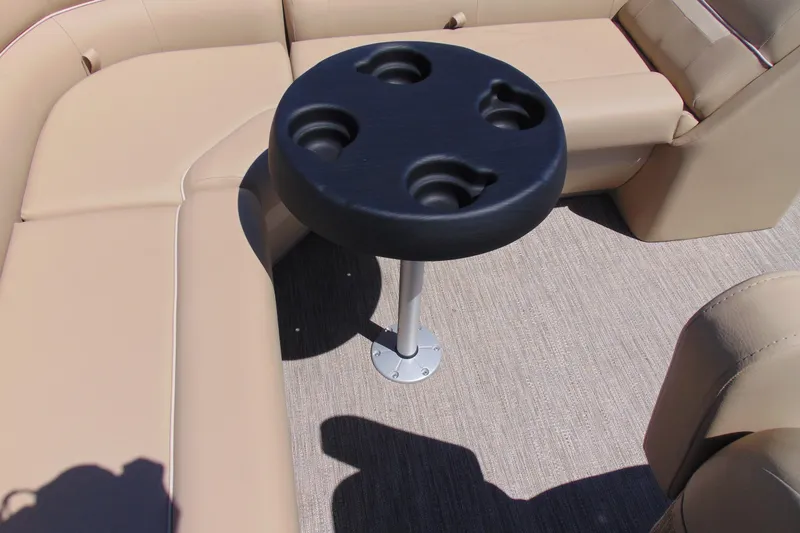 Slide: The Image of Beige seating and cup holder on 2026 Godfrey EX 1880CX boat interior. - 12
