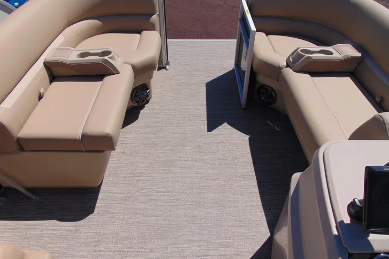 Slide: The Image of Interior of 2026 Godfrey EX 1880CX pontoon boat with beige seating and cup holders. - 14