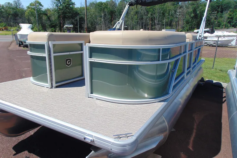 Slide: The Image of 2026 Godfrey EX 1880CX pontoon boat with beige seating and sleek design. - 3