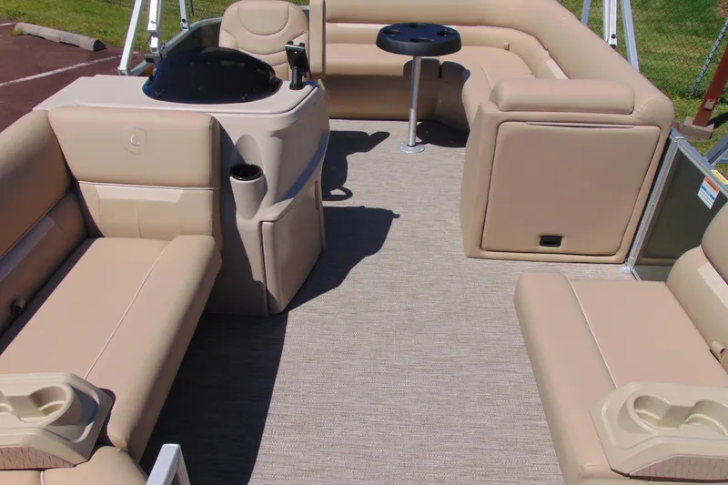Slide: The Image of Luxurious interior of 2026 Godfrey EX 1880CX pontoon boat with beige seating and table. - 6