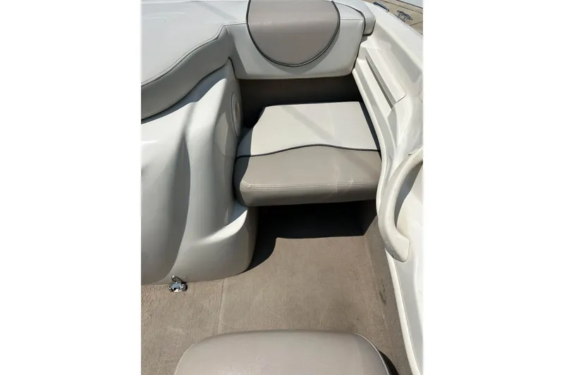 Slide: The Image of 2003 Sea Ray 182 SRX Bow Rider interior with beige and white seating. - 16