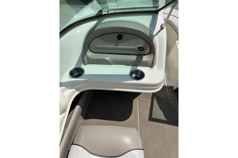 Slide: The Image of 2003 Sea Ray 182 SRX Bow Rider interior seating, featuring gray and white upholstery. - 19