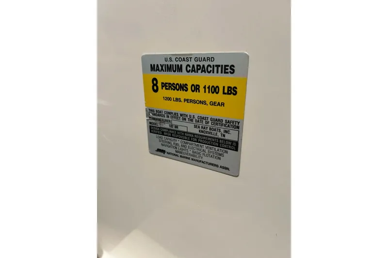 Slide: The Image of 2003 Sea Ray 182 SRX Bow Rider dashboard with stereo and cup holder. - 22