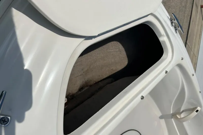 Slide: The Image of Open storage compartment on 2003 Sea Ray 182 SRX Bow Rider boat. - 33
