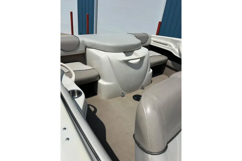 Slide: The Image of 2003 Sea Ray 182 SRX Bow Rider logo on red and white boat exterior. - 6