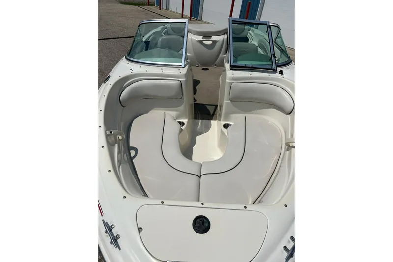 Slide: The Image of 2003 Sea Ray 182 SRX Bow Rider logo on white boat exterior. - 7
