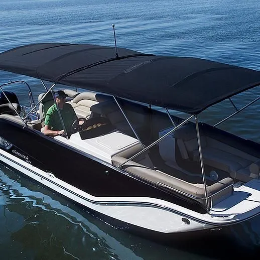 Slide: The Image of 2020 Bayliner Element XR7 boat with canopy cruising on calm water. - 1