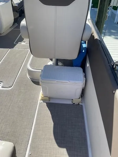 Slide: The Image of 2020 Bayliner Element XR7 boat interior with seat and cooler. - 13