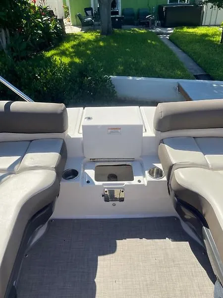 Slide: The Image of 2020 Bayliner Element XR7 boat interior with seating and storage area. - 22