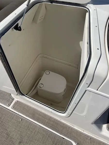 Slide: The Image of 2020 Bayliner Element XR7 boat interior with compact marine toilet. - 27