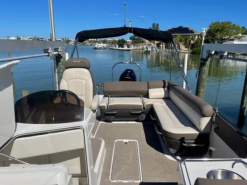 Slide: The Image of 2020 Bayliner Element XR7 boat interior with spacious seating and waterfront view. - 31
