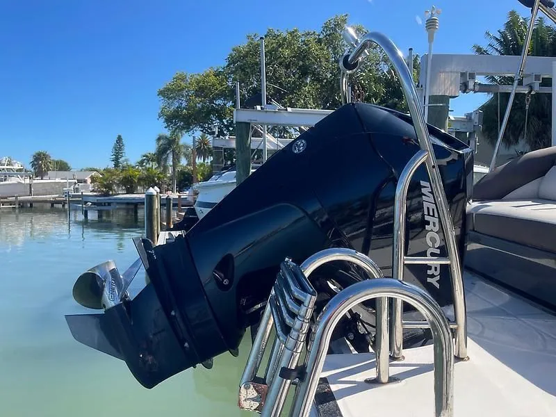 Slide: The Image of 2020 Bayliner Element XR7 with Mercury outboard motor docked by calm waters. - 35