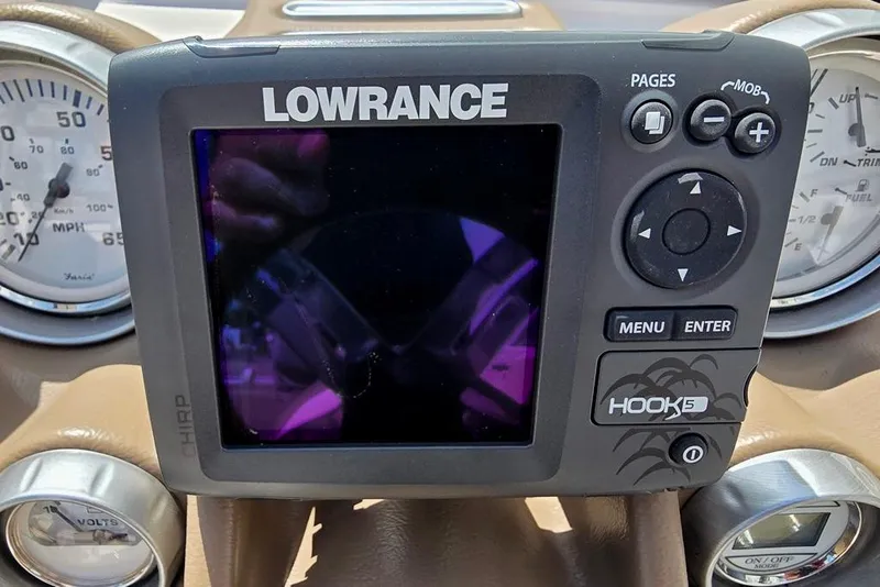 Slide: The Image of Lowrance Hook 5 fishfinder on 2013 Glastron GLS 195 BR dashboard, surrounded by gauges. - 15
