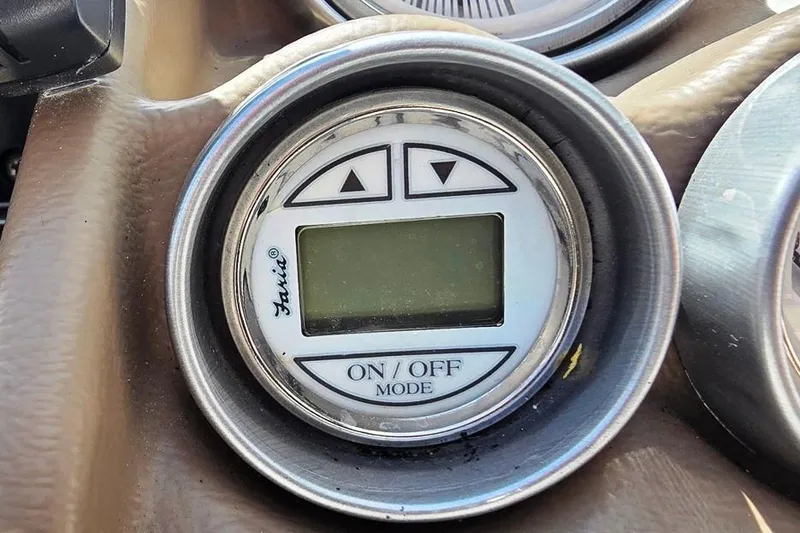 Slide: The Image of Digital gauge on 2013 Glastron GLS 195 BR boat dashboard, featuring on/off mode controls. - 16