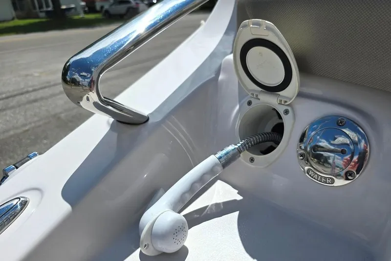 Slide: The Image of 2013 Glastron GLS 195 BR boat water outlet and shower handle detail. - 19